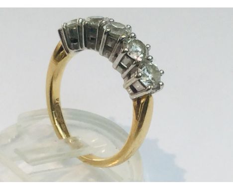 An 18ct yellow gold diamond ring set with five round brilliant cut diamonds in a claw setting, total weight of diamonds 1.50c