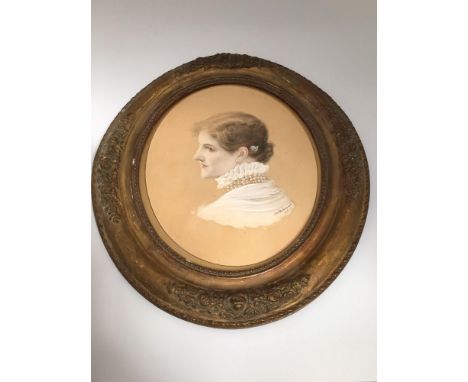 An oval portrait of a lady with pearl necklace and white ruffled blouse with flower in her hair, signed 'Walter Seymour 1878'