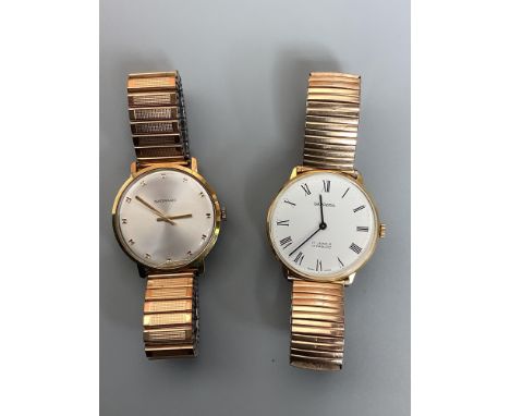 Two gold-plated wristwatches by Garrard, one with white enamel dial and Roman numerals denoting hours, the other with silvere