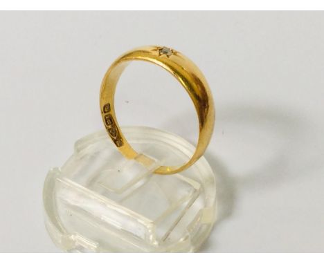 An 18ct gold diamond ring, set with a small victorian cut diamond to the centre in a star setting, weighs 3.5 grams. 