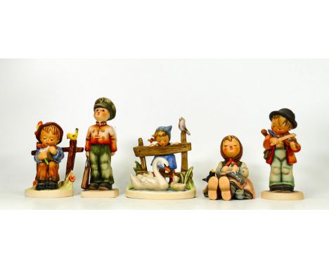 A collection of Goebel Hummel figures including Girl with Swan, Boy Sitting by fence, Toy soldier, Boy with Violin , tallest 
