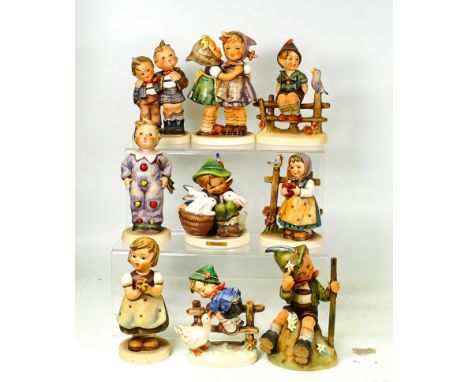 A collection of Goebel Hummel figures including Playmates, Sweet Greetings, Girl with Posy, Mountaineer, Clown, Best Friends 