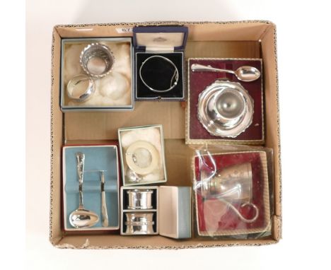 A collection of silver and silver plated items to include silver napkin rings, bangle, bowl together with plated egg cup and 