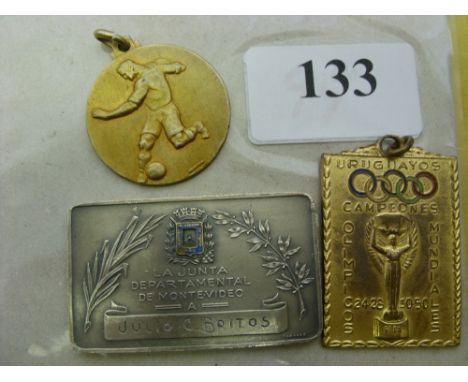 Julio C Britos, a collection of 3 medals as inscribed and given to Mr Britos, who was a official member of the Uruguayan Pres