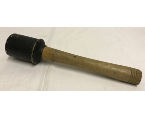 Re-enactors wooden German stick grenade.  