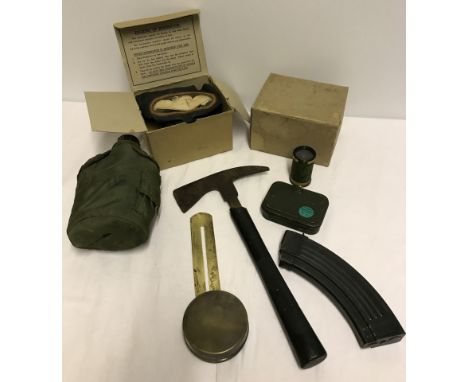 A box of assorted military items to include water bottle, axe & button polishing guard.  