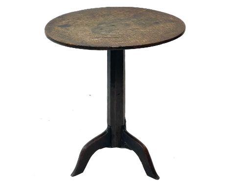 A late Georgian primitive oak circular occasional table. With a figured top, on a chamfered pillar and tripod base, height 62