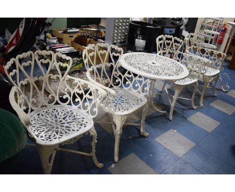 A Circular Pierced Topped Metal Table and Four Metal Garden Chairs Together with Tripod Torchere Stand and Six Shelf Saucepan