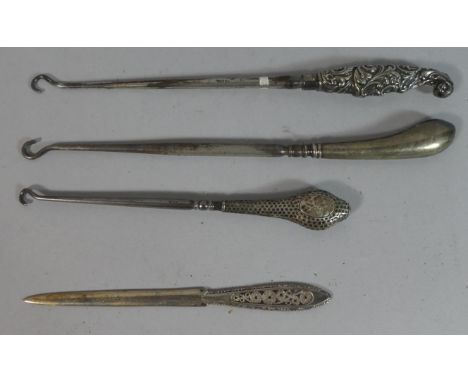 A Collection of Three Silver Handled Button Hooks and a Continental White Metal Letter Opener with Pierced Handle 