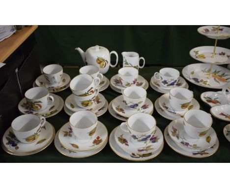 A Collection of Royal Worcester Evesham Teawares to Include Twelve Trios, Teapot and Milk Jug 