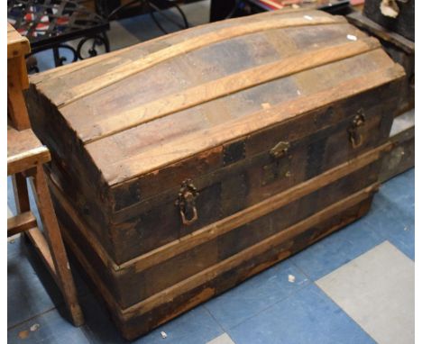 A Good Quality Leather Covered and Wooden Banded Dome Top Travelling Trunk, 88cm Wide 
