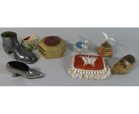 A Collection of Various Vintage Pin Cushions to Include Boot Examples, Ceramic Lion, Seagull, Butterfly, Vintage Tin etc 