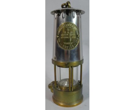 A Brass and Steel Miners Safety Lamp by the Protector Lamp and Lighting Company 