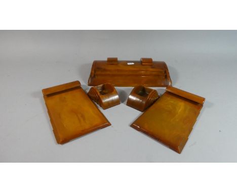 An Art Deco Five Piece Desk Set in Butterscotch Phenolic Bakelite by Carvacraft, a Dickenson Product to Include Pen Rest and 