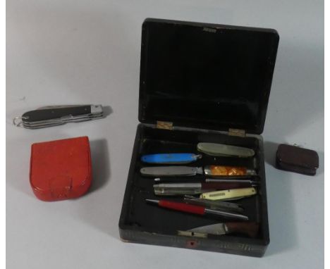 An Oriental Lacquered Box Containing Various Vintage Penknives, Ball Point Pens etc 