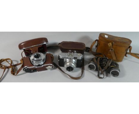 Two Vintage Leather Cased Cameras by Voigtlander and Kodak Together with a Pair of Cased Binoculars 