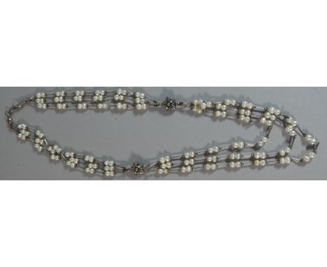 A Pearl Necklace having Floral Beads 