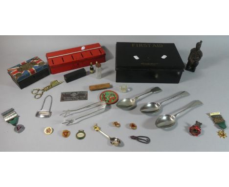 A Vintage First Aid Tin Containing Tin Money Boxes, Silver Plated Cutlery, Badges, Curios etc 