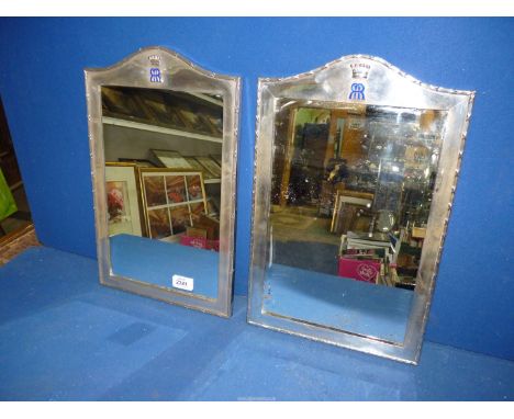 A pair of large Silver dressing table mirrors having reed and ribbon pattern border with blue enamel initials to the top and 