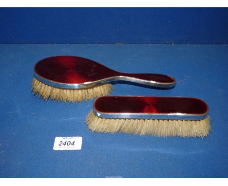 A ladies Silver brush, Edinburgh 1925 by Hamilton &amp; Inches, together with a gentleman's brush having red Guilloche enamel