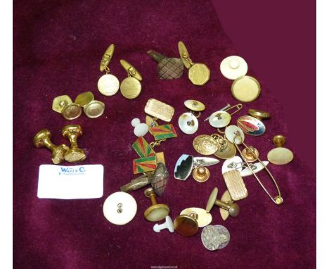 A quantity of cufflinks including a pair of 9ct gold studs, a pair of German Silver cufflinks, a pair of gilt and enamel cuff