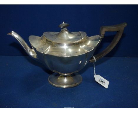 An elegantly shaped Silver Teapot with ebonised handle, London 1903, 607g including handle.