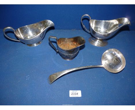 A small quantity of silver plated tableware to include; two sauce boats, a soup ladle, cream jug, etc.