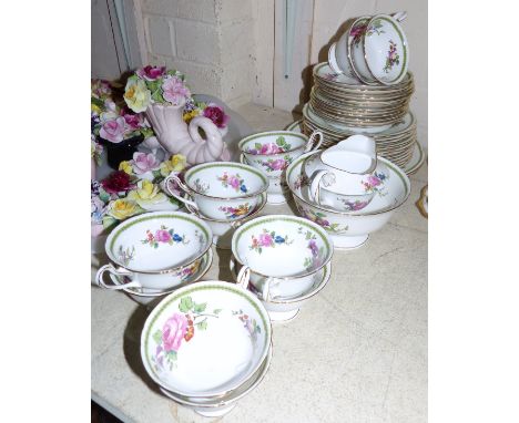 A Shelley bone china tea service comprising 12 cups and saucers, 12 plates, 2 bread and butter plates, cream jug and sugar bo