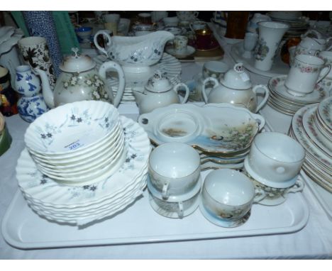 A Royal Doulton bone china Millefleur dinner service; a Japanese tea service