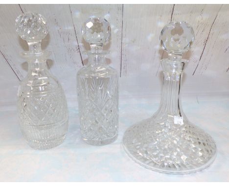 A Waterford glass decanter; a similar picture frame; a Royal Doulton decanter; and another