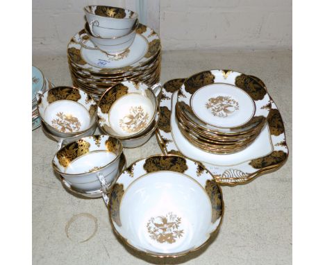 An early 20th century Tuscan China part tea service in gilt and black, 34 pieces approx