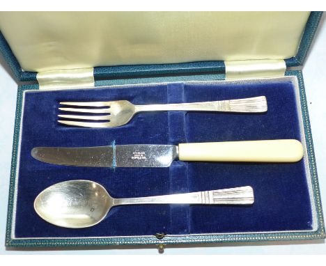 A 3 piece christening set, cased; a hallmarked silver fork and spoon; a knife