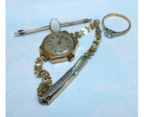 An 18 carat gold dress ring set single diamond; a 9 carat gold bar brooch set opal; a ladies watch in 9 carat gold case