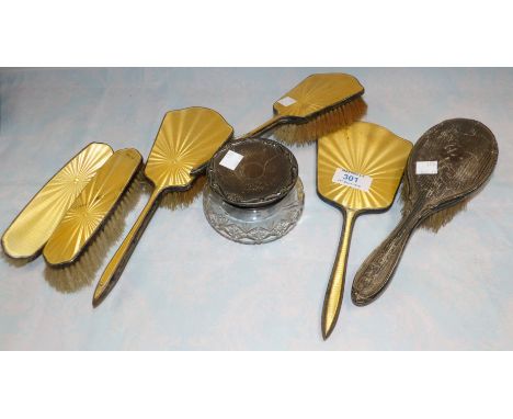 A silver and yellow enamel 4 piece dressing table set, Birmingham 1940 (2 pieces enamel a.f.); a silver engine turned hair an