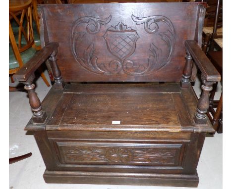 An oak Jacobean style monk’s bench with carved decoration