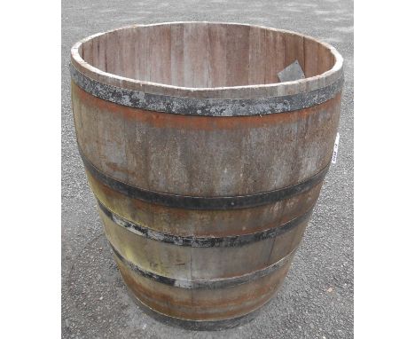 A large French coopered barrel, cut down for use as a very large planter