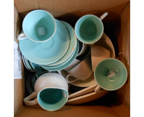 A box containing a quantity of Poole Pottery dinnerware in the green and beige colourways