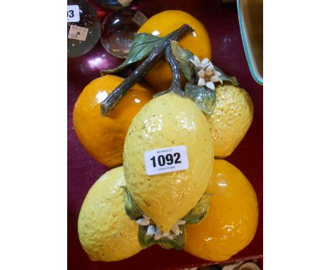 An Italian ceramic sculptural form depicting oranges and lemons in a bunch