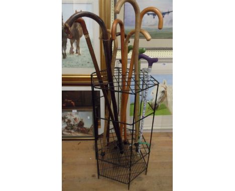 A stick stand containing assorted sticks