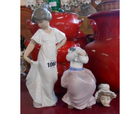 Two Nao figurines depicting young girls - one with head re-glued