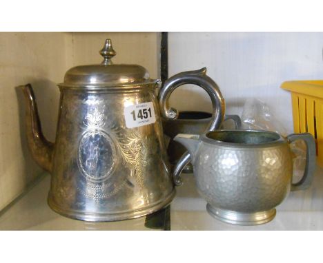 A late Victorian silver plated teapot - sold with a hammered pewter Unity milk jug and sugar bowl - sold with a pair of silve