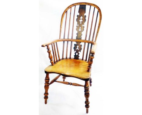 A antique yew and elm Windsor hoop stick back elbow chair with decorative pierced splat back and moulded solid elm seat, set 