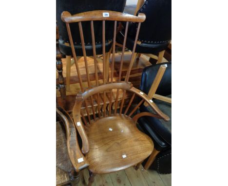 An antique high stick back elbow chair with solid elm moulded seat, set on turned supports - old repair fillet to underside o