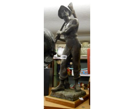 A 19th Century French spelter figure depicting a miner on later wooden plinth - solder repairs to arm and axe