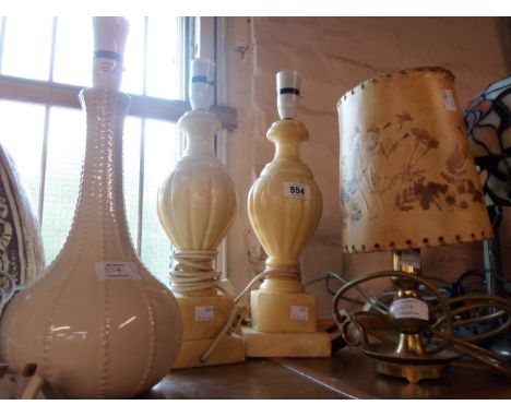 A pair of alabaster table lamps of urn form with flaking lacquer finish - sold with a small brass table lamp and a ceramic si