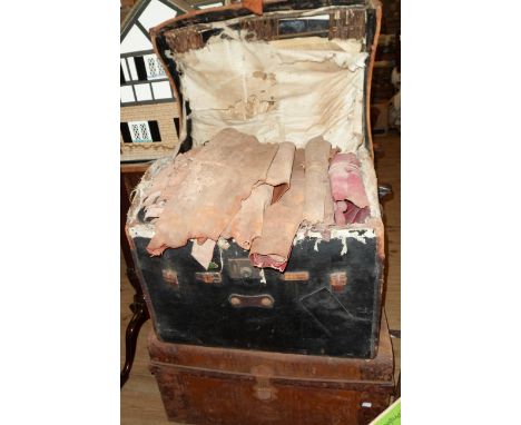 An old leather trunk containing a large quantity of leather material pieces - sold with a tin trunk containing material piece