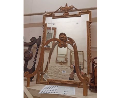 A vintage Aesonia ornate gilt wood wall mounted console mirror, with urn pediments bevelled and cut plate, set on a serpentin