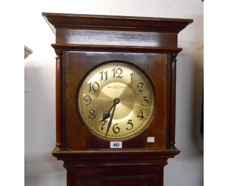 A vintage walnut longcase clock by Bravingtons of London with circular brass dial and visible pendulum, with twin weight driv