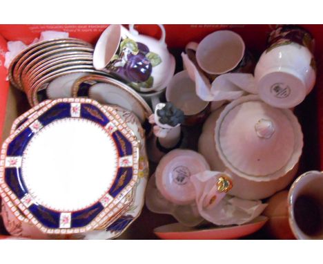 A box containing a quantity of assorted ceramic items including mugs, teapot, etc.