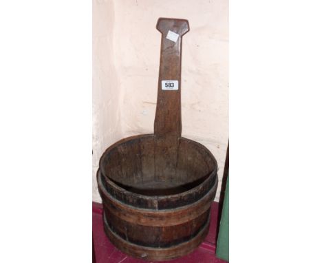 An antique coopered bucket form milk ladle